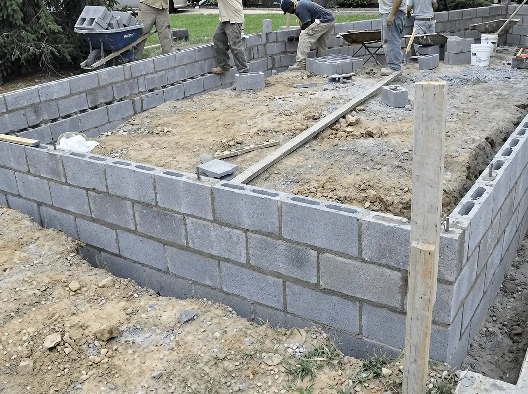 Professionals building a foundation with blocks in Bakersfield, CA