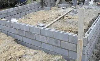 Professionals building a foundation with blocks in Bakersfield, CA