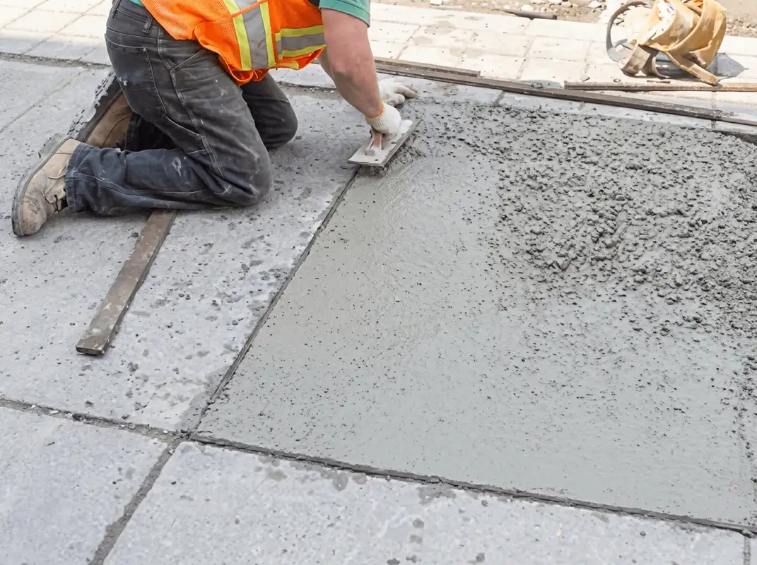 Professional repairing a concrete floor in Bakersfield, CA