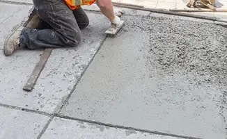 Professional repairing a concrete floor in Bakersfield, CA