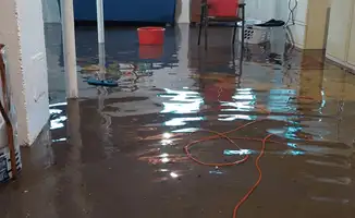 Basement with boiler, cabinets and washing machine completely flooded in Bakersfield, CA