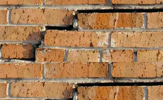 Brick wall with serious structural damage in Bakersfield, CA